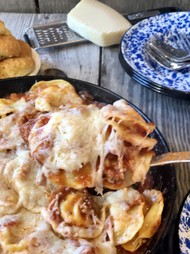 Easy Ravioli Casserole from Farmwife Feeds is a hearty meal that is ready in less than 30 minutes or can be prepped ahead for busy nights.