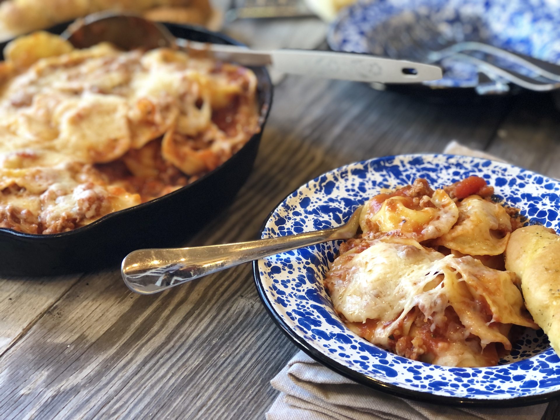 Easy Ravioli Casserole from Farmwife Feeds is a hearty meal that is ready in less than 30 minutes or can be prepped ahead for busy nights.