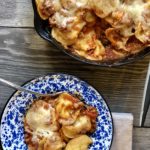 Easy Ravioli Casserole from Farmwife Feeds is a hearty meal that is ready in less than 30 minutes or can be prepped ahead for busy nights.