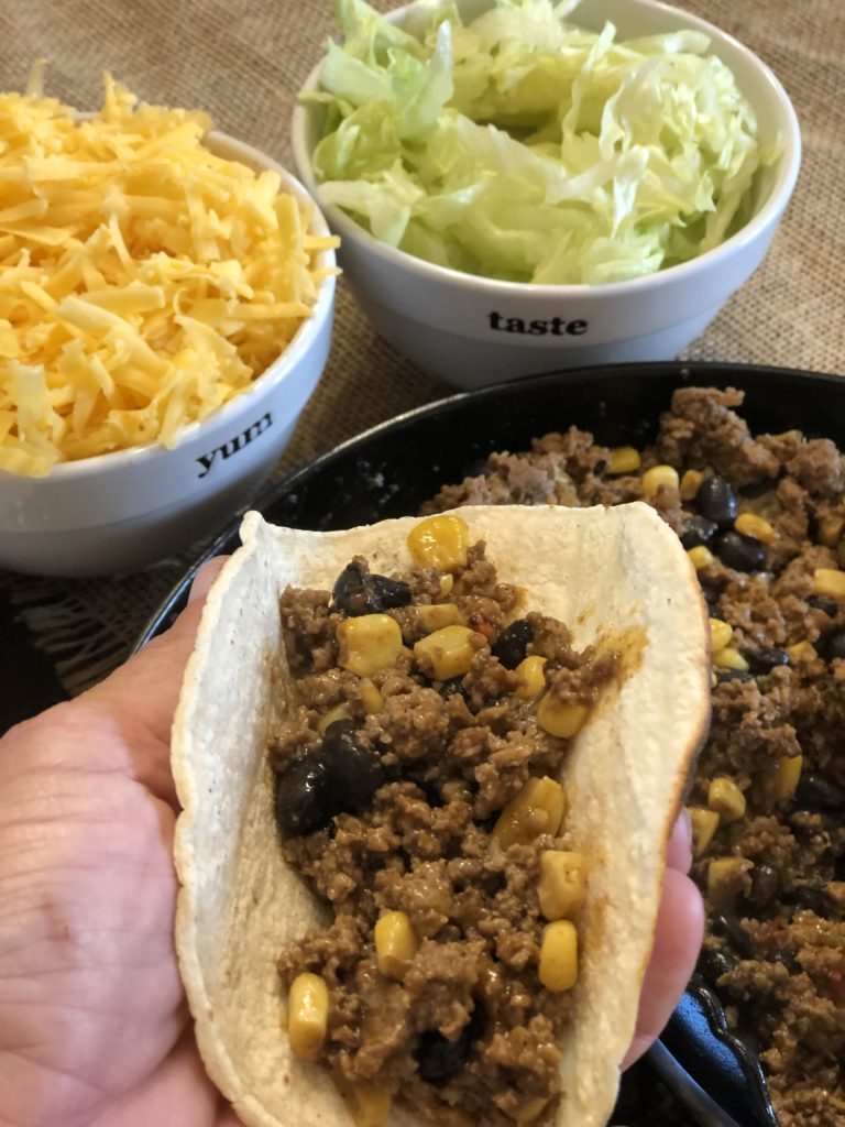 Easy Loaded Skillet Taco Meat from Farmwife Feeds is a one pan meal loaded with meat, veggie and beans for an easy busy night meal for the family. #onepan #taco #mexican