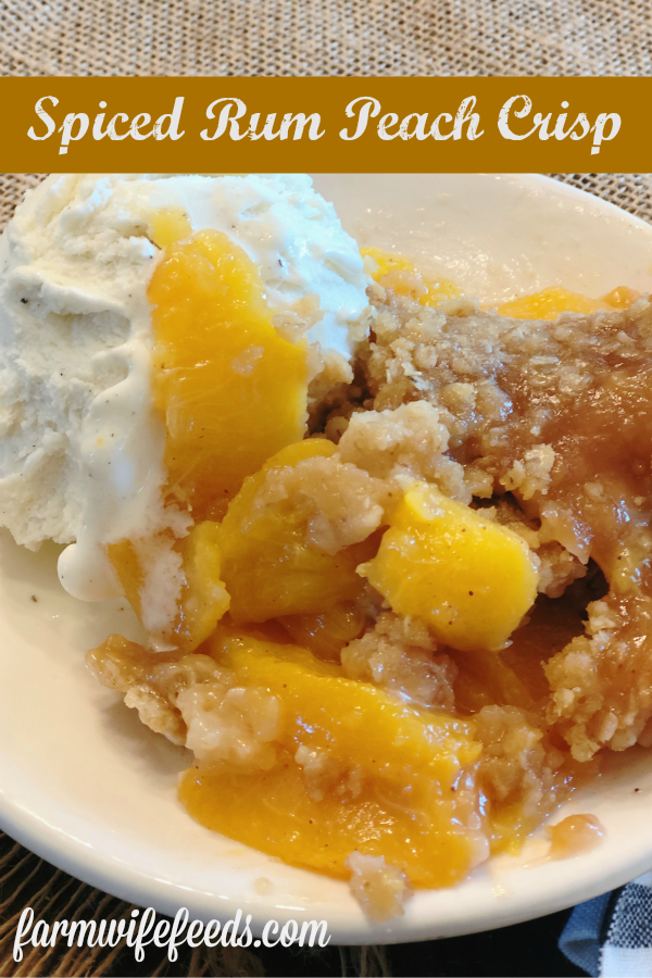Spiced Rum Peach Crisp from Farmwife Feeds is the perfect fresh peach dessert with a spicy warmness that pairs perfect with ice cream. #peachcrisp #peaches #fruit