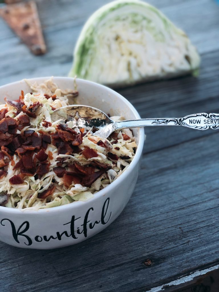 Smoky Bacon Slaw from Farmwife Feeds cabbage with smoky seasonings and crumbled bacon for the win. #slaw #cabbage #bacon