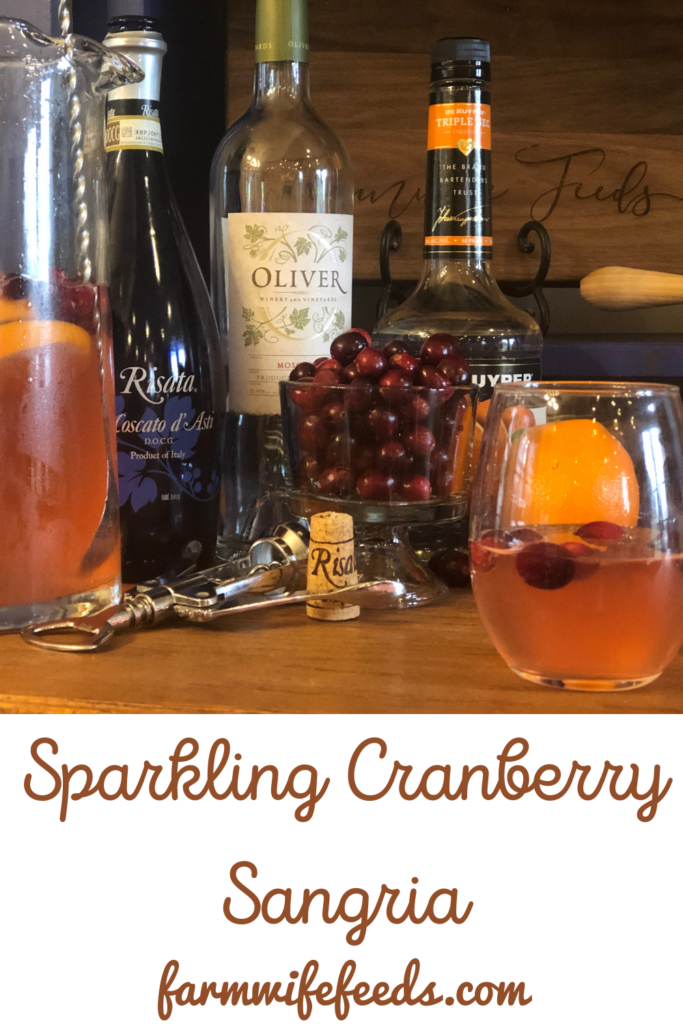 Sparkling Cranberry Sangria from Farmwife Feeds, cranberries and oranges flavor moscato topped off with your favorite bubbly. #sangria #wine #cocktail