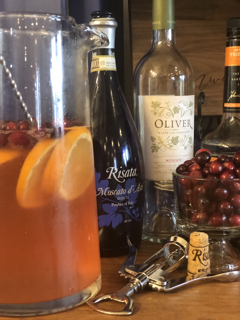 Sparkling Cranberry Sangria from Farmwife Feeds, cranberries and oranges flavor moscato topped off with your favorite bubbly. #sangria #wine #cocktail