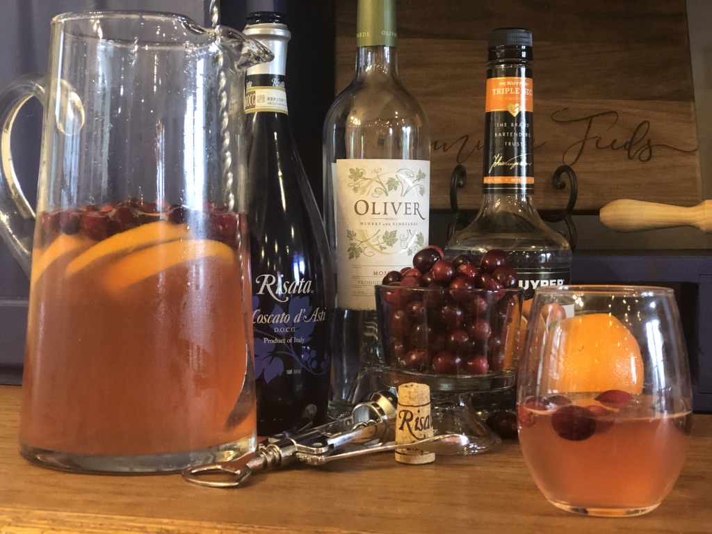 Sparkling Cranberry Sangria from Farmwife Feeds, cranberries and oranges flavor moscato topped off with your favorite bubbly. #sangria #wine #cocktail