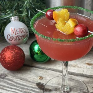 Cranberry Christmas Cocktail from Farmwife Feeds, holiday spirits in a glass. Festive and flavorful is the name of the game with orange and cranberry flavors. #christmascocktail #cranberry #whippedvodka