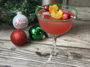 Cranberry Christmas Cocktail from Farmwife Feeds, holiday spirits in a glass. Festive and flavorful is the name of the game with orange and cranberry flavors. #christmascocktail #cranberry #whippedvodka