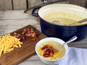 Creamy Corn Chowder from Farmwife Feeds. A hearty and filling meal with bacon and cheese for an ultimate comfort food. #chowder #corn #bacon #soup