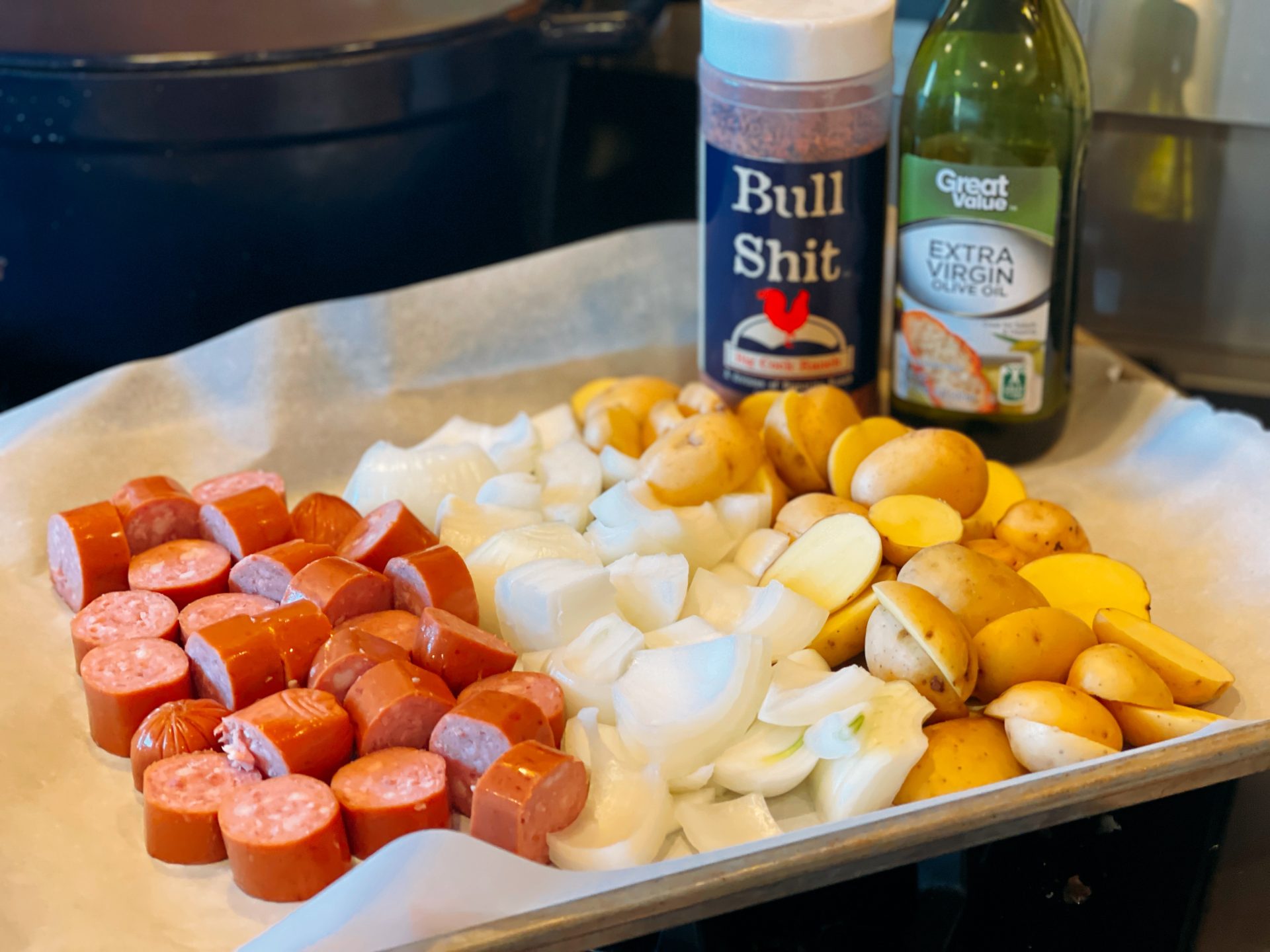 Oven Roasted Smoked Sausage and Potatoes from Farmwife Feeds, an easy sheet pan dinner on busy weeknights using your family favorite seasoning. #sheetpanmeal #onepan #smokedsausage