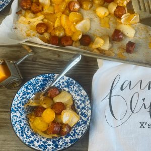 Oven Roasted Smoked Sausage and Potatoes from Farmwife Feeds, an easy sheet pan dinner on busy weeknights using your family favorite seasoning. #sheetpanmeal #onepan #smokedsausage