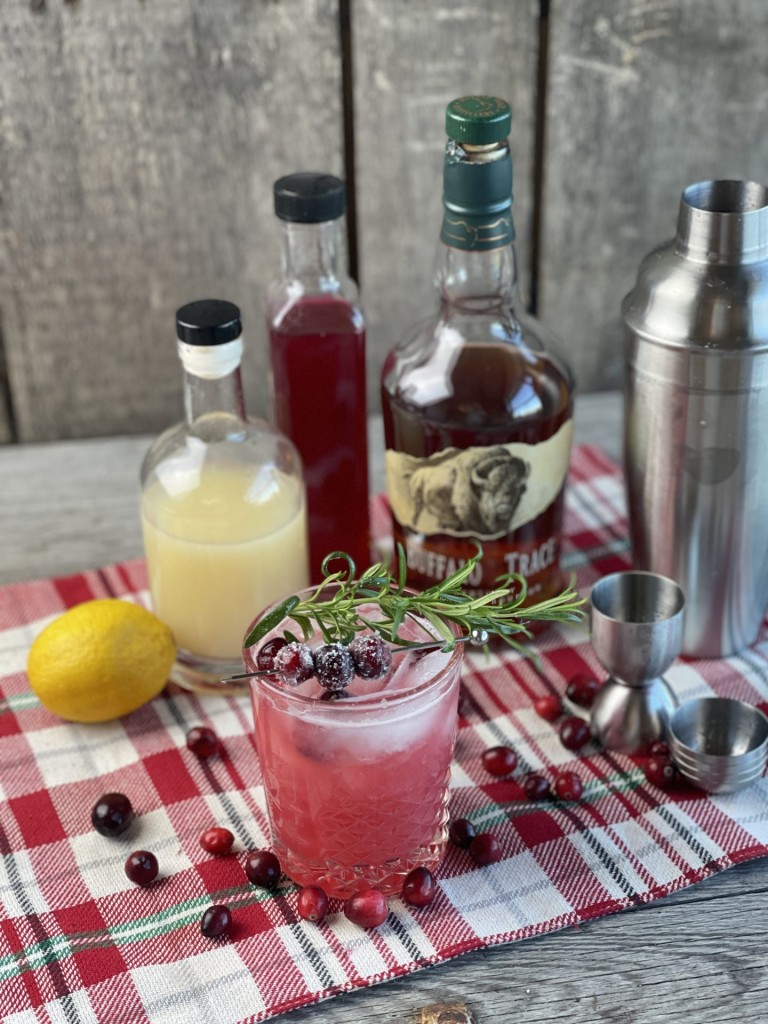 Cranberry Whiskey Sour from Farmwife Feeds. A festive twist on a classic cocktail, perfect during the holiday season. #whiskeysour #cranberry #cocktail #holidaydrink