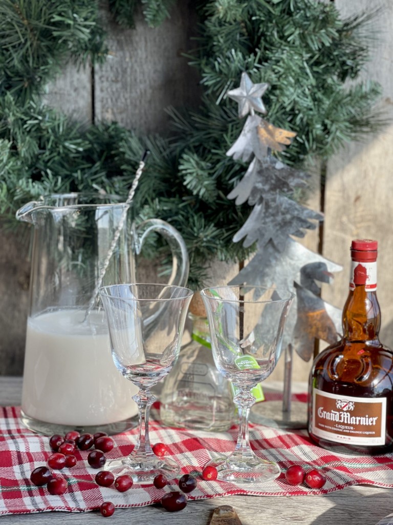 White Christmas Cocktail from Farmwife Feeds. A dreamy creamy coconut mixed drink that mixed by the pitcher for quiet nights or a holiday party. #holidaycocktail #coconut