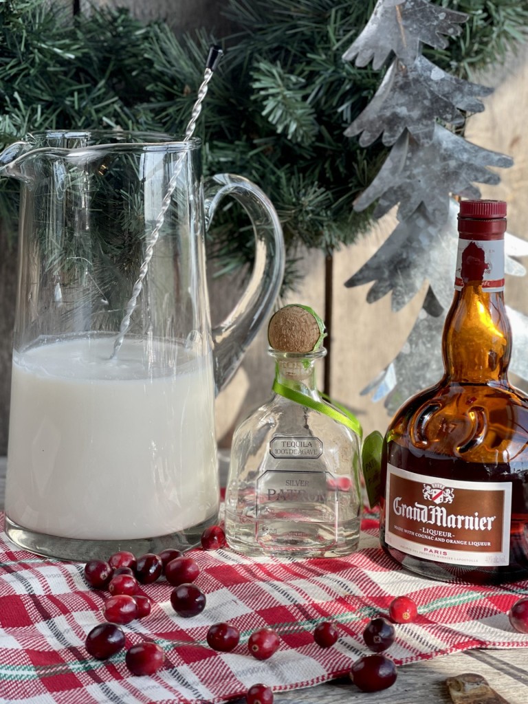 White Christmas Cocktail from Farmwife Feeds. A dreamy creamy coconut mixed drink that mixed by the pitcher for quiet nights or a holiday party. #holidaycocktail #coconut