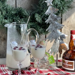 White Christmas Cocktail from Farmwife Feeds. A dreamy creamy coconut mixed drink that mixed by the pitcher for quiet nights or a holiday party. #holidaycocktail #coconut