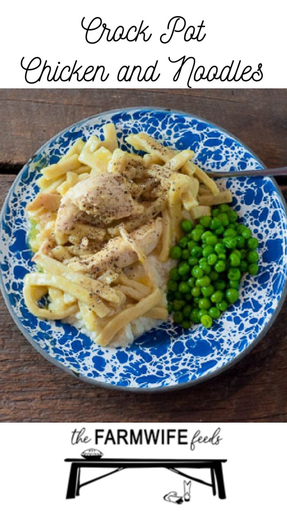 A plate of crockpot chicken and noodles over mashed potatoes with a side of fresh peas