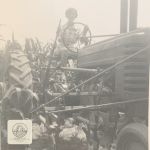 Vintage photo of a young farm woman driving a tractor in a cornfield, featured in the Farmwife Life story "Leaning into Jesus and Margaritas."
